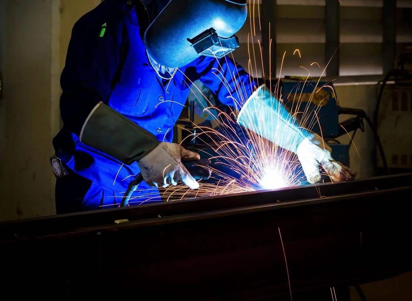 Marine welding work underway during ship repair and fabrication.